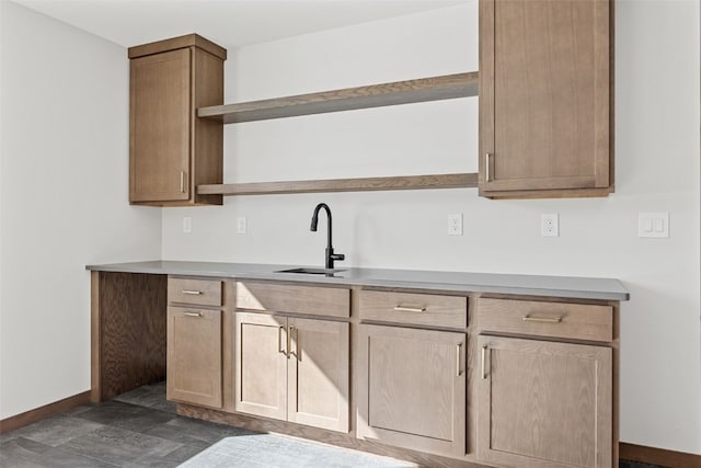 2733 Brookfield Dr, Marion, IA 52302 - kitchen featuring open shelves, a sink, baseboards, and light countertops