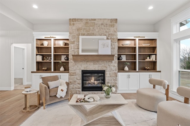 2733 Brookfield Dr, Marion, IA 52302 - living area with light wood-type flooring, a stone fireplace, and recessed lighting