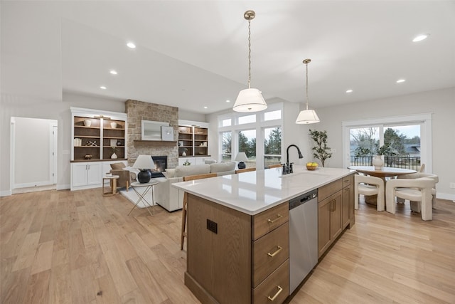 2733 Brookfield Dr, Marion, IA 52302 - kitchen featuring a sink, stainless steel dishwasher, light wood finished floors, a fireplace, and recessed lighting