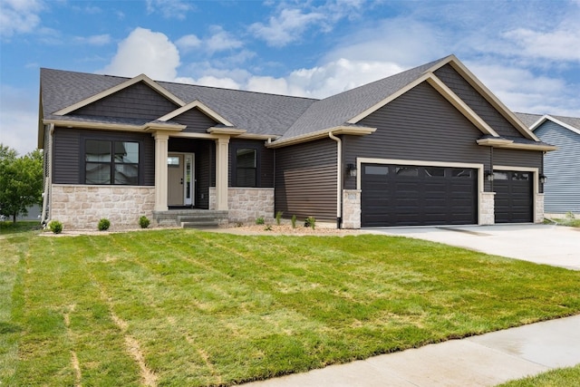 2733 Brookfield Dr, Marion, IA 52302 - craftsman-style house with a garage, stone siding, concrete driveway, and a front lawn