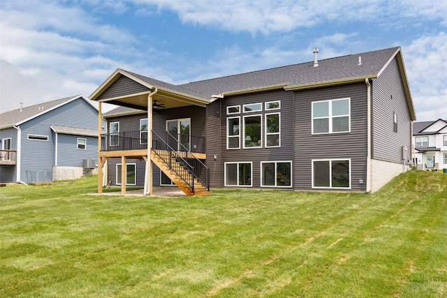2733 Brookfield Dr, Marion, IA 52302 - back of property featuring stairway, a ceiling fan, a lawn, and a deck