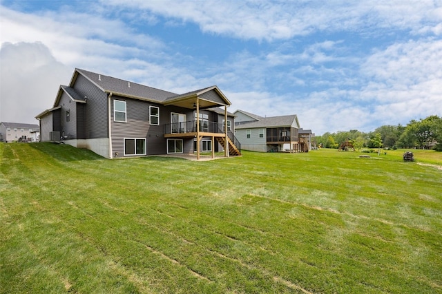 2733 Brookfield Dr, Marion, IA 52302 - back of house with stairs, a wooden deck, and a yard