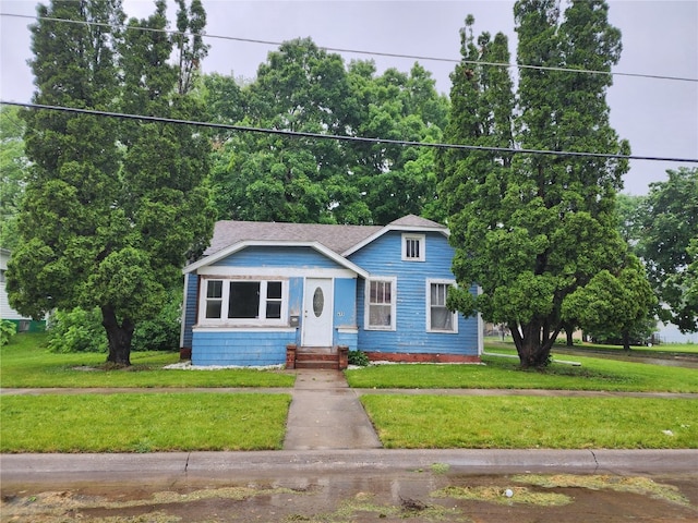 bungalow with a front lawn