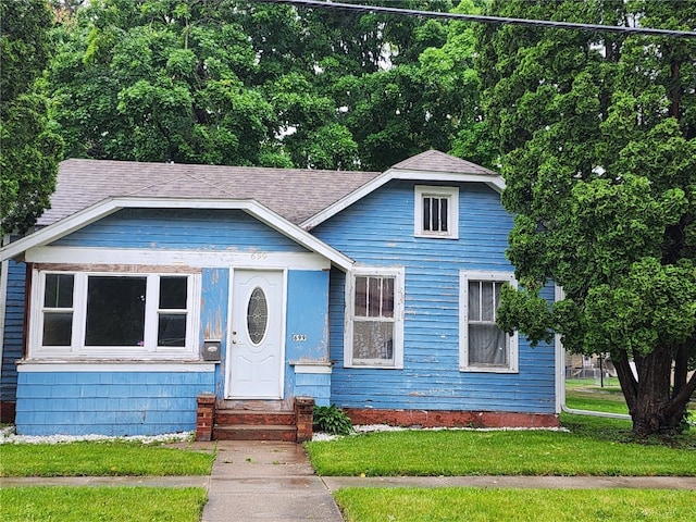 bungalow with a front yard