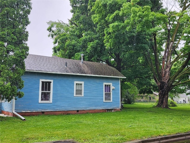 view of home's exterior featuring a yard