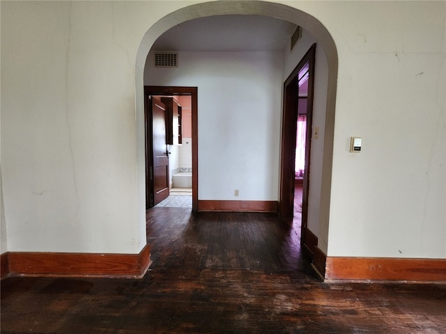 hall featuring dark wood-type flooring