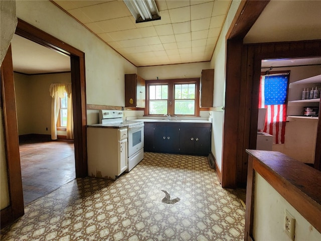 kitchen with sink, white range with electric cooktop, and light tile floors