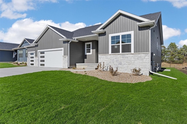 view of front of property featuring a garage and a front lawn