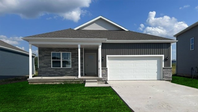 ranch-style home featuring board and batten siding, a front lawn, a porch, concrete driveway, and a garage