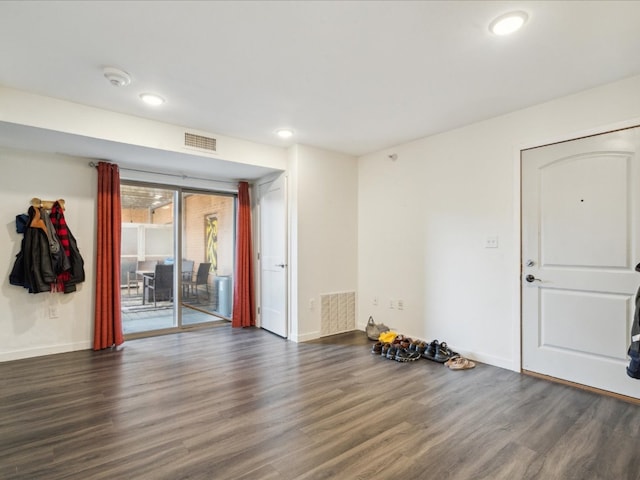 spare room featuring dark hardwood / wood-style flooring