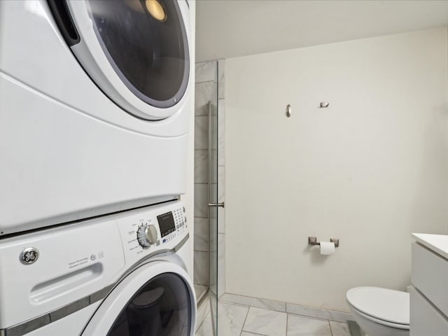 washroom with stacked washer and clothes dryer and light tile flooring