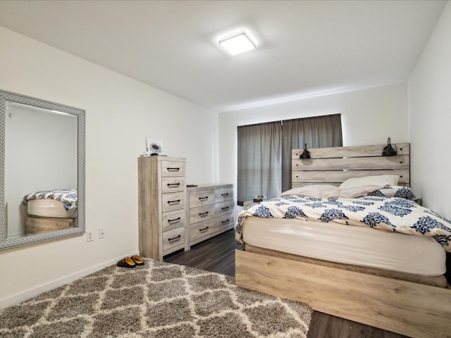 bedroom featuring dark hardwood / wood-style floors