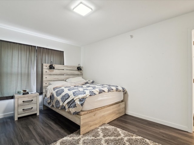 bedroom featuring dark hardwood / wood-style floors