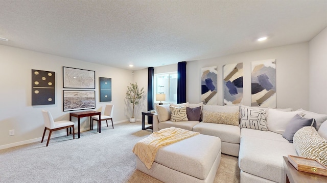 living room featuring light carpet and a textured ceiling