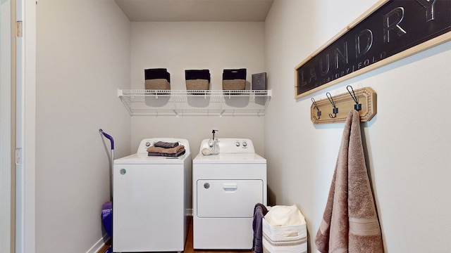 laundry area featuring washing machine and clothes dryer