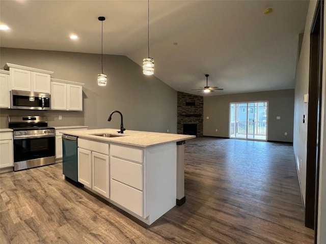 kitchen with white cabinetry, sink, ceiling fan, decorative light fixtures, and appliances with stainless steel finishes