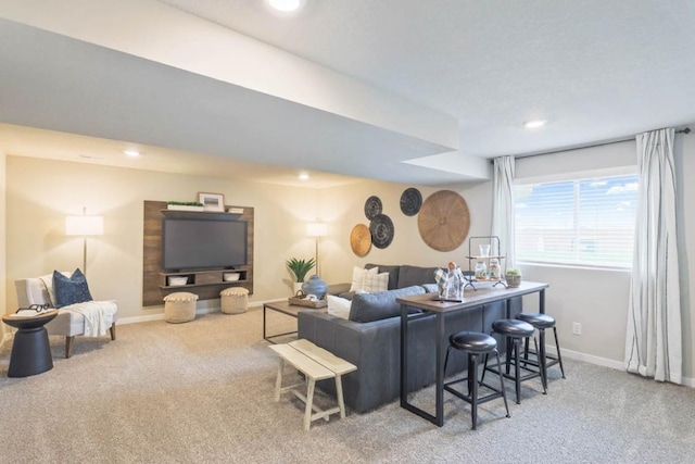 carpeted living room featuring indoor bar