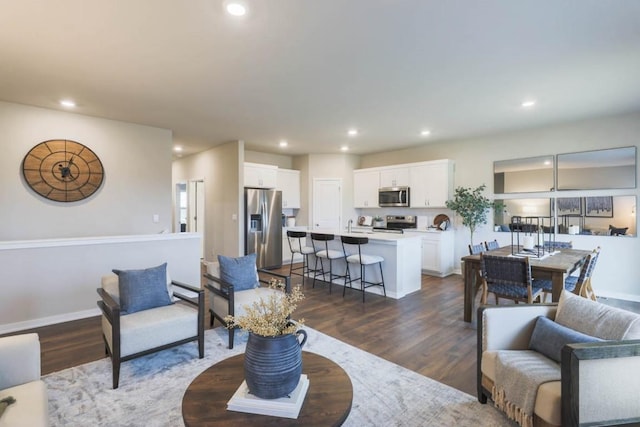 living room featuring dark wood-type flooring