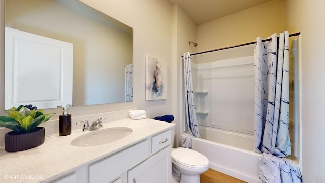 full bathroom with vanity, wood-type flooring, shower / tub combo, and toilet