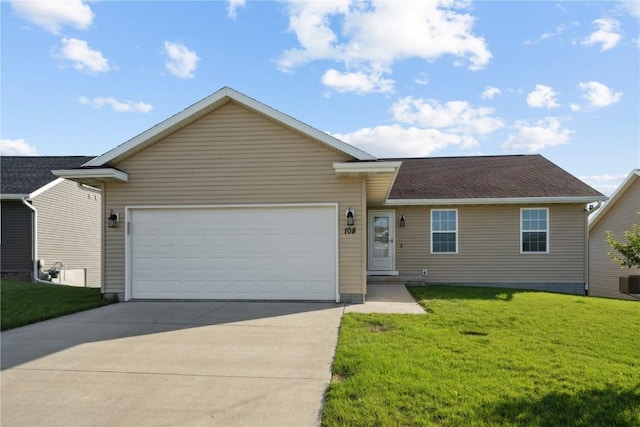 single story home featuring a front yard and a garage