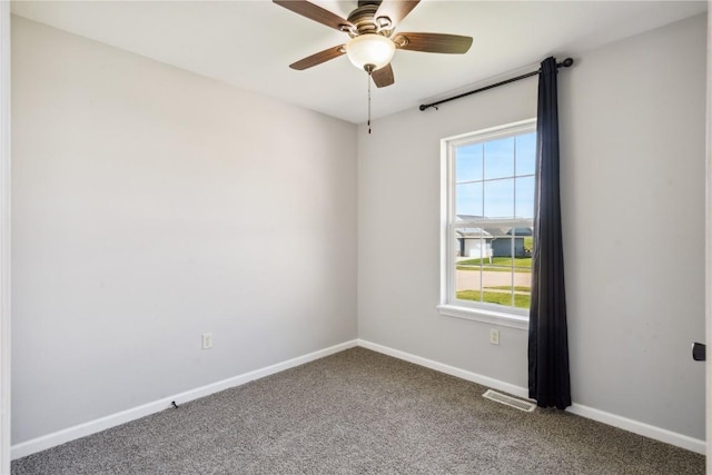 spare room with carpet and ceiling fan