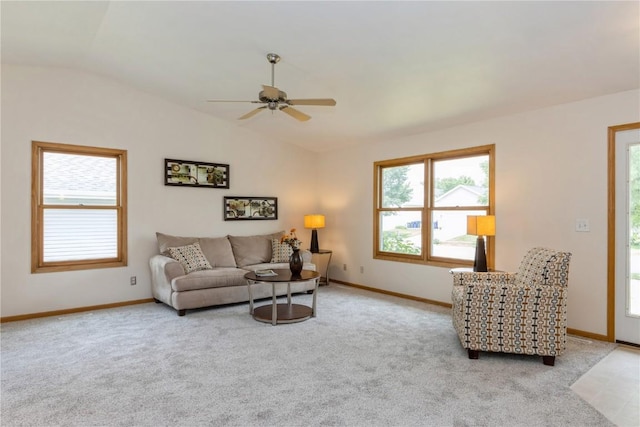 living room with ceiling fan, light carpet, and vaulted ceiling