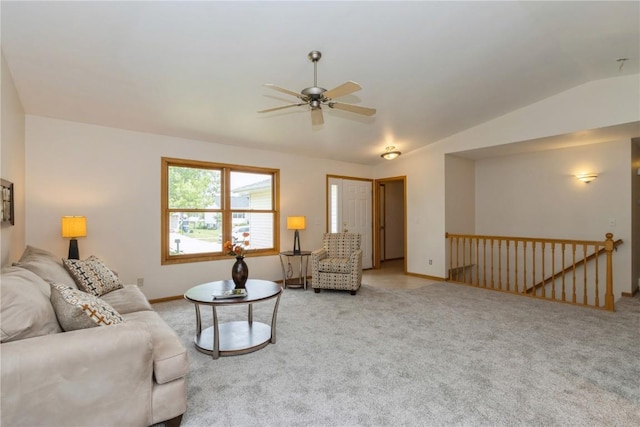 carpeted living room featuring ceiling fan and lofted ceiling