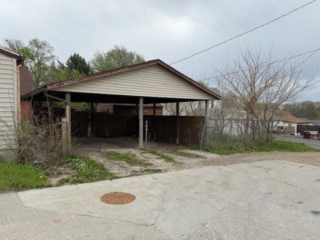 view of outbuilding with a carport