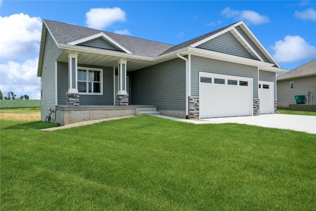 craftsman house featuring a front yard and a garage