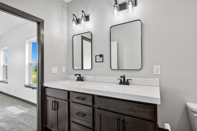 bathroom with vanity and toilet