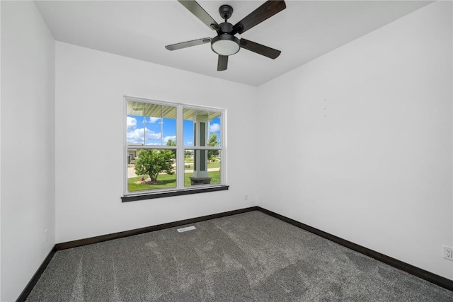 spare room with carpet flooring and ceiling fan