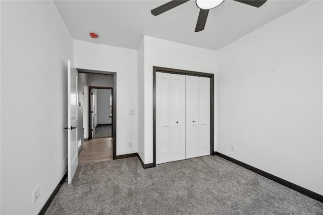 unfurnished bedroom with carpet flooring, ceiling fan, and a closet