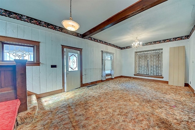 entryway with a notable chandelier