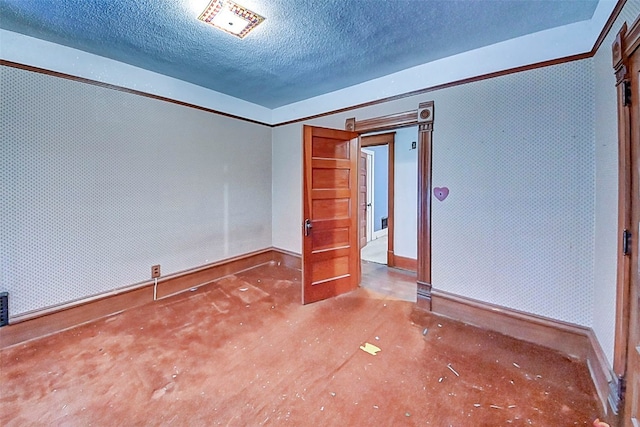 unfurnished room featuring a textured ceiling