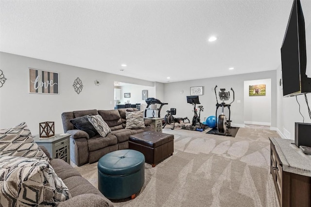 living room with light carpet and a textured ceiling