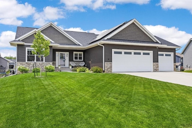 craftsman house with a front lawn and stone siding