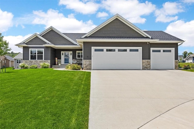 craftsman inspired home with a garage and a front yard