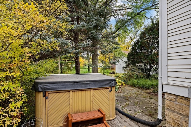 deck featuring a hot tub