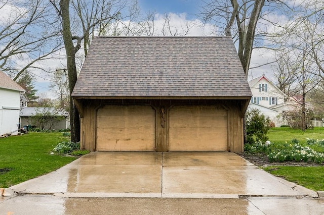 garage featuring a lawn