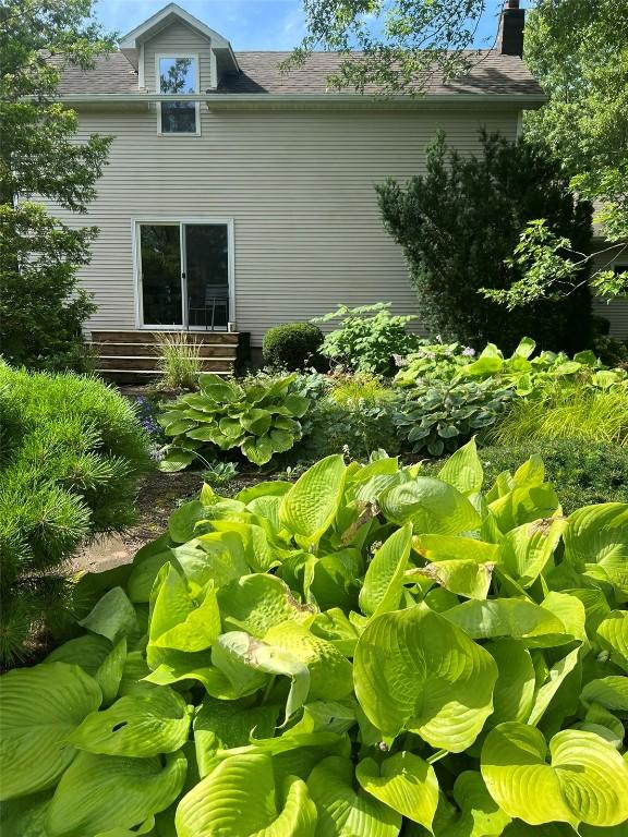 view of side of property featuring a chimney