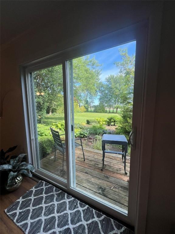 doorway to outside featuring wood finished floors