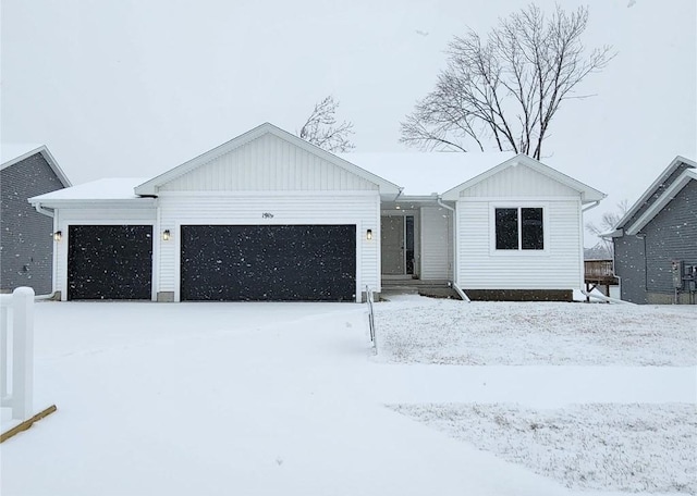 view of front of home featuring board and batten siding and an attached garage