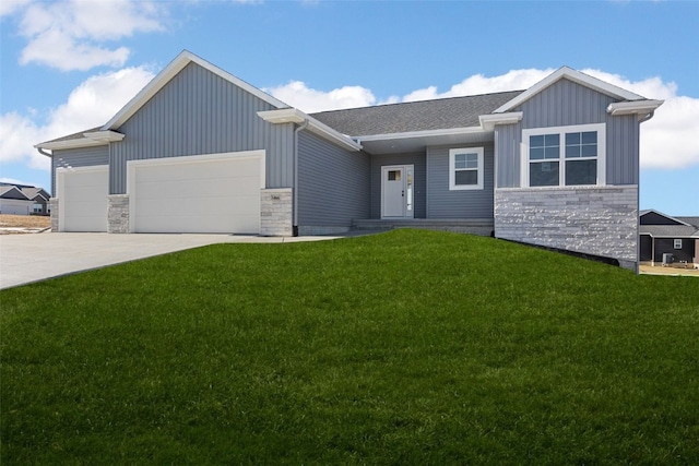 view of front of home featuring a garage and a front lawn