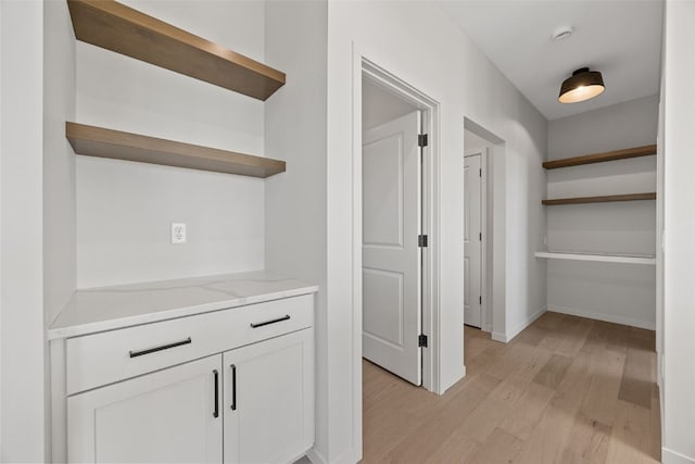 corridor featuring light hardwood / wood-style flooring