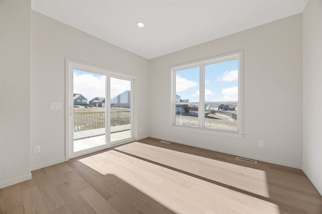 spare room featuring hardwood / wood-style flooring