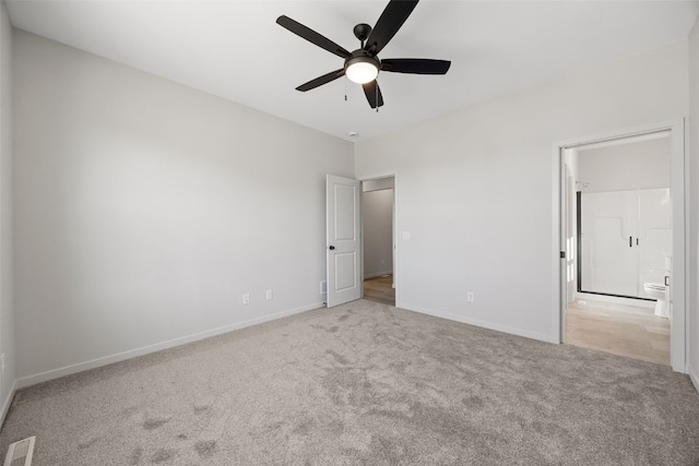 unfurnished bedroom featuring ceiling fan and light carpet