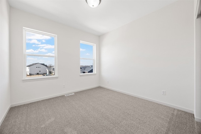 unfurnished room featuring carpet floors