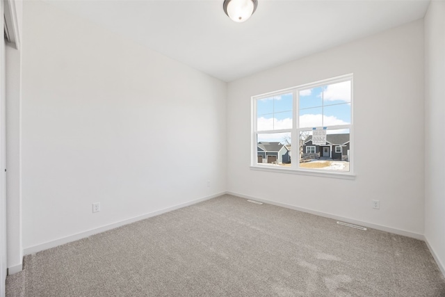 empty room featuring carpet flooring