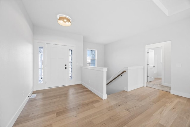 entryway with light hardwood / wood-style floors