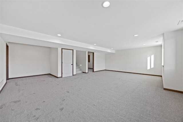 basement with light colored carpet